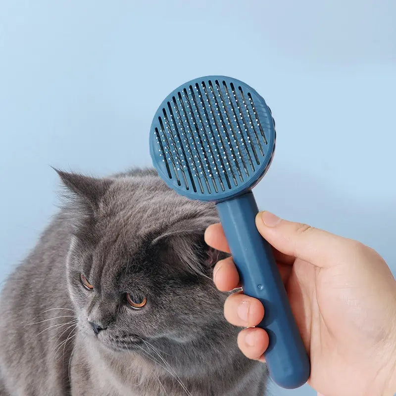 Cepillo removedor con función de masaje para el aseo de pelo desaliñado y flotante; ideal para perros y gatos
