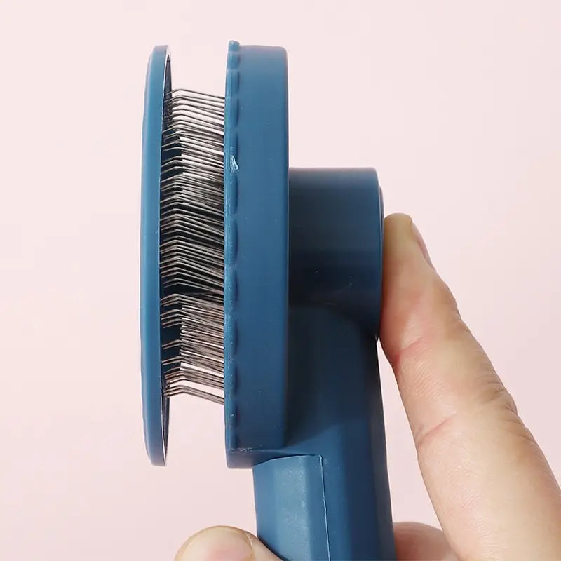 Cepillo removedor con función de masaje para el aseo de pelo desaliñado y flotante; ideal para perros y gatos